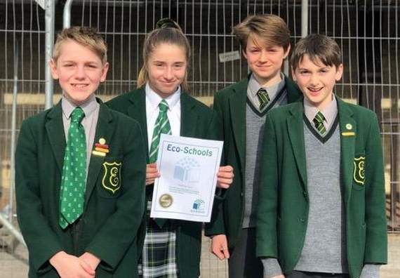 Eco-committee pupils show off their certificate
