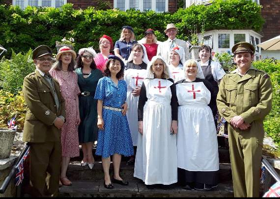 Turning the clock back at Redcot for National Care Home Open Day are Sharon Fields (second left, middle row), staff and guests