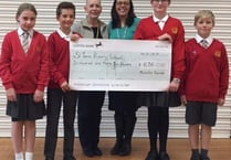 Elstead hairdresser's generous donation to school