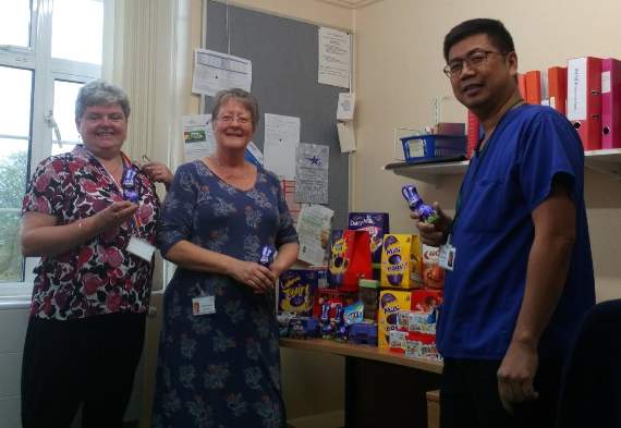 Happy Easter! Pictured at Haslemere Hospital with food bank donations from left, Lisa Taylor, Jenny Wright and Mark Clemente