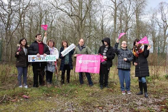 Adult learners, carers and staff celebrate their big win from the lottery fund