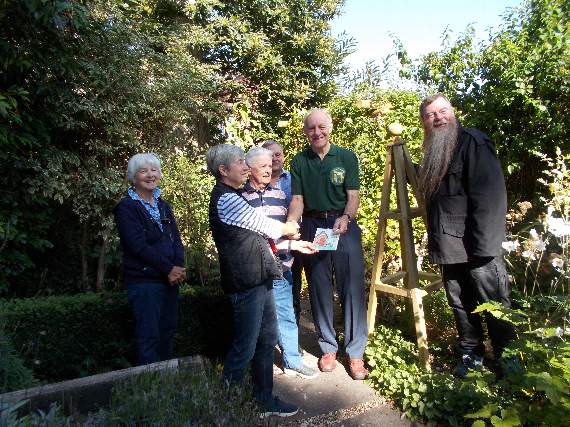 Friends and gardeners join manager Toby Mearing (right) in thanking Alton Men’s Shed members for their work in the Allen Gallery garden