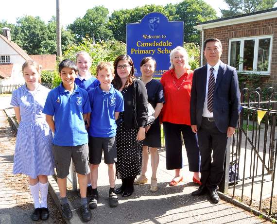 Camelsdale headteacher Sarah Palmer with pupils and some of the school’s Chinese visitors. Picture Ruth Marshall (HD28-276-19)