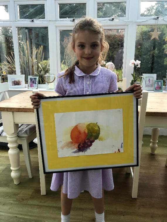 Daisy Holmes-Bowers with her painting