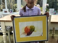 Daisy Holmes-Bowers with her painting