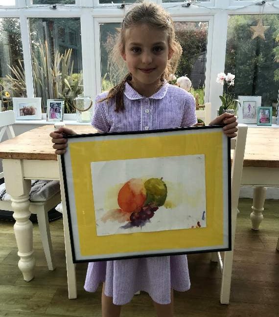Daisy Holmes-Bowers with her painting
