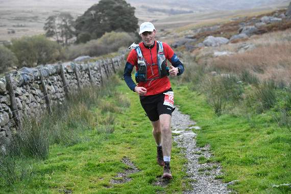 Farnham Runners athlete David Roy is all smiles as he tackles the gruelling Snowdon Ultra in north Wales. PIC: GB ULTRAS