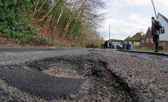Woolmer Hill Road pothole. Picture by Pete Gardner