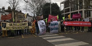 Climate protesters in scuffle with police ahead of Surrey council meeting