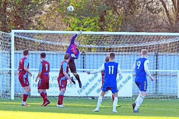 Badshot Lea goalkeeper Kallum Lunn makes a fingertip save. Picture order no: FD03-04-20
