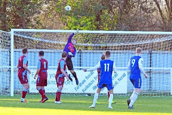 Badshot Lea goalkeeper Kallum Lunn makes a fingertip save. Picture order no: FD03-04-20