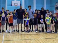 Former Harlem Globetrotter uses basketball to promote positivity