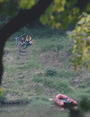 A fire and rescue crew rests on the riverbank at Bigsweir after taking the body from the water.