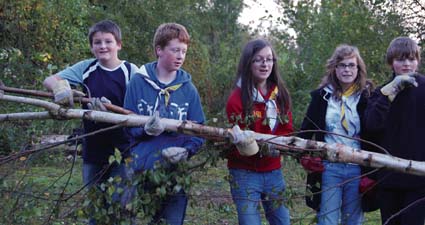 • Magor Explorer Scouts clear one of the encroaching trees.