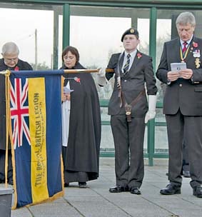 •Caldicot British Legion standard bearer Andrew Roberts at the Sunset Service.