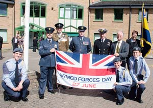 •Corporal Jon Slip, Royal Auxiliary Air Force, Captain Andy Kuss of 1 Rifles, Flight-Lieutenant Rick Seager of the Royal Auxiliary Air Force, Gary McKenzie of HMS Cambria, Forest Council vice-chairman Cllr James Bevan, Pat Short of the Royal British Legion and air cadets Oliver Green, James Hawkins and Bryn Kearsey with the Armed Forces Day flag.