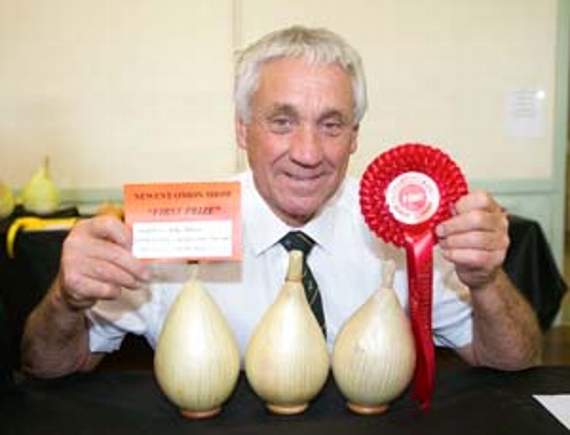 •Mike Davies with one of his prizes.