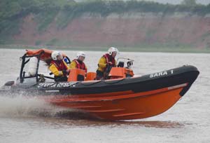 • SARA1 on the Severn with crew members Ryan and Gemma Hewitt and Mark Carwardine.
