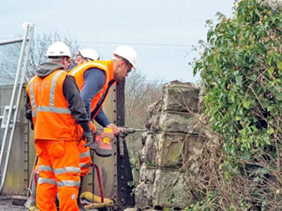 •Network Rail workers repairing some of the damage.
