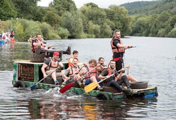 •The team from Forest-based carpentry firm Hadleigh gets underway with a drum beat to keep the rhythm steady.