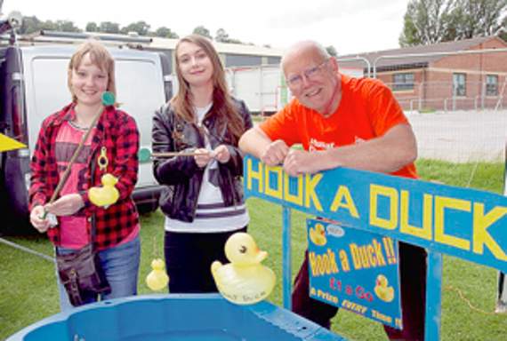 •Duck fishing experts Ellie Evans and Laura Hyde on the Muscular Dystrophy UK stall run by Martin Whitehouse.