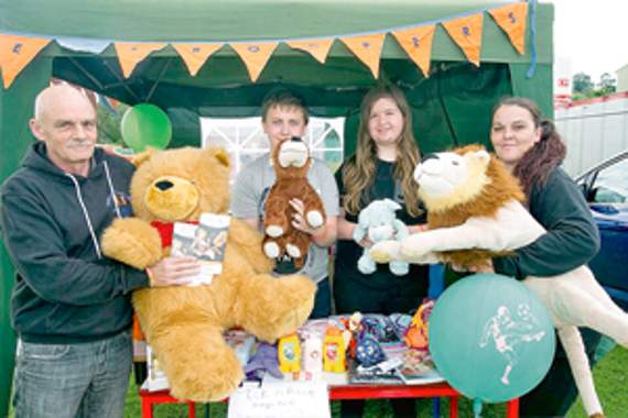 •Looking after the ‘Our Little Troopers’ stall for terminally ill children with Battan Disease were Gordon Penn, Tommy Penn, Megan English and Tina Penn.