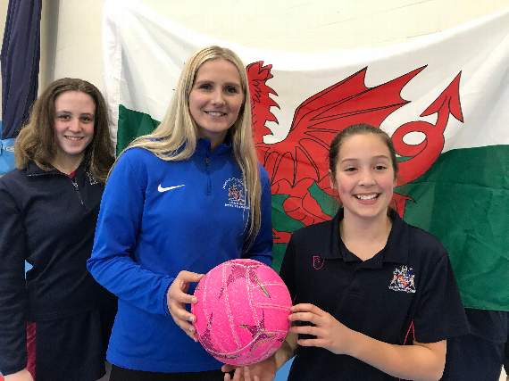 Chelsea Lewis with Monmouth School for Girls netballers Victoria Morris and Annie Taylor.