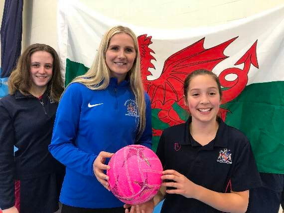 Chelsea Lewis with Monmouth School for Girls netballers Victoria Morris and Annie Taylor.