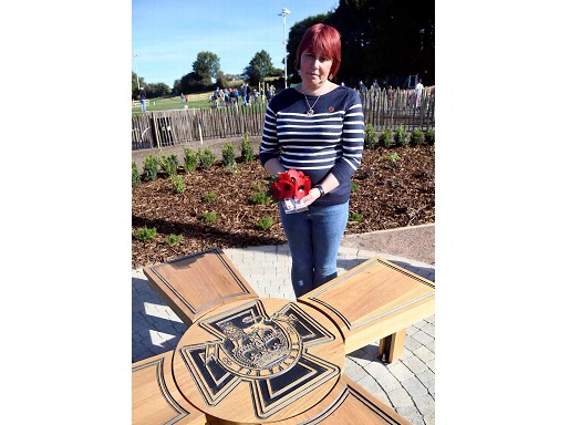 Town councillor Nicky Holloway at bench dedicated to Angus Buchanan VC.