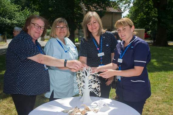 Dressing the remembrance tree at the Dilke are staff members Sam Nurden, Tracy Jones, Kay Howells and Ann Hurcombe.