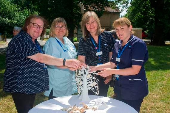 Dressing the remembrance tree at the Dilke are staff members Sam Nurden, Tracy Jones, Kay Howells and Ann Hurcombe.