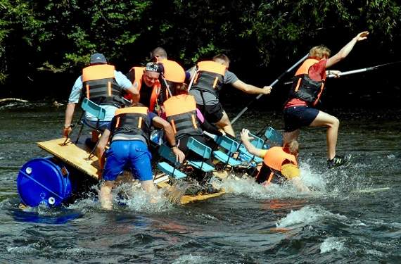 Man overboard as a raft comes a cropper at the rapids.