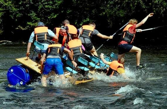 Man overboard as a raft comes a cropper at the rapids.
