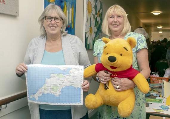 Challenging people to guess where Pooh had been on holiday were the hospice’s education facilitator Gail Cooper, and Sue Elsmore.