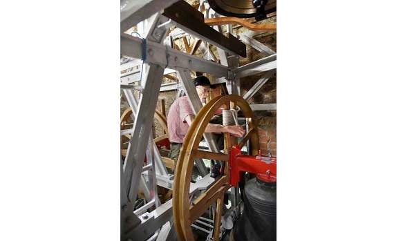 Project co-ordinator Andy Vivian helps with installation. Photo Graham Champken.