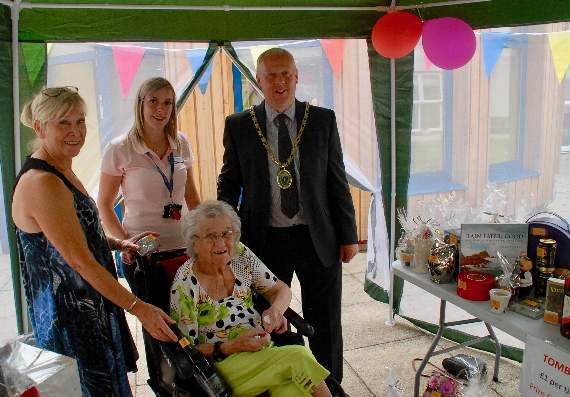 Lesley Colquhoun, Maria Watkins, Stephanie Burford and Coleford town mayor Cllr Nick Penny try their luck with the tombola.