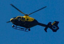 Police helicopter searches farmland at holiday park