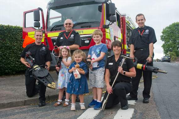 Lydney fire fighters Jack Randell-Tredgett, watch manager Chris Jones, CM Katie Butcher, and Ian Bayliss with future fire fighters Amelie Burgum, Lilly Farr and Tobias Burgum.