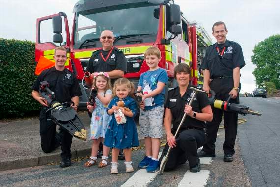 Lydney fire fighters Jack Randell-Tredgett, watch manager Chris Jones, CM Katie Butcher, and Ian Bayliss with future fire fighters Amelie Burgum, Lilly Farr and Tobias Burgum.