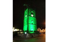 Clock tower goes green for recycling campaign