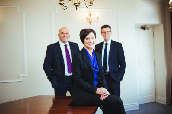 Happier days at Duncan Lawrie Private Bank.  Sue Preskey, pictured last March with private client director Nigel Bolt (left) and finance director Steven Quayle