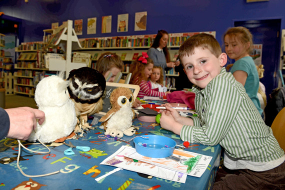 Owls from the Wildlife Park visit the Family Library in Douglas - Will Gerrard (5) with Bugg the spectacled owl