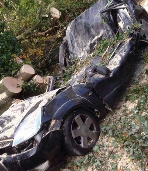 A car crushed by a tree in Saddle Road, Douglas