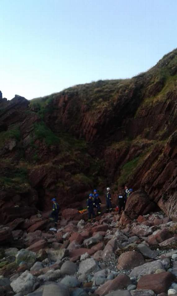 A teenager was injured after falling onto rocks
