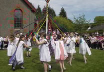 Brownies and Rainbows give a cultural performance on May Day