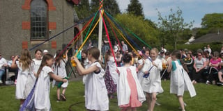 Brownies and Rainbows give a cultural performance on May Day