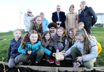 Brownies bury badges and beloved items to be uncovered in 10 years