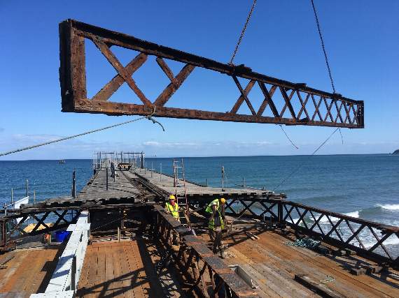 The second iron girder is craned out