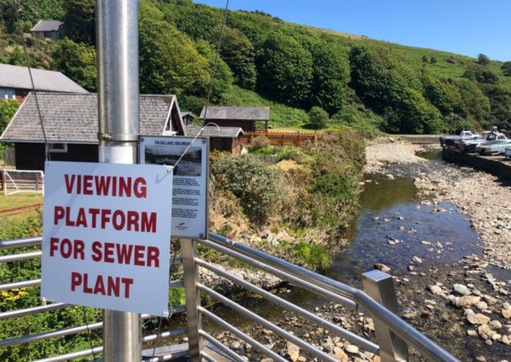 Signs opposing plans to erect new sewage treatment works in Laxey were spotted overlooking the proposed spot