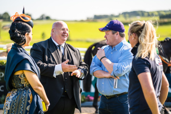 Vincent Caldwell with his wife Annie, leading Irish trainer Gordon Elliott and the head girl from the Elliott yard